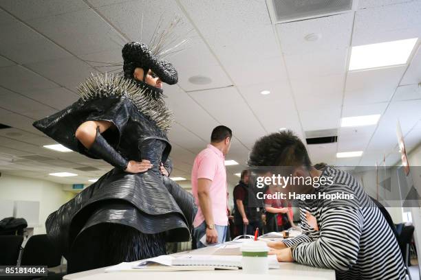 Emma Martin, dressed in World of WearableArt garment 'Refuse Refuge' by Grace DuVal of the United States, votes at Wellington City Library on...