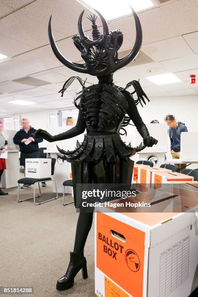 Tarikura Kapea, dressed in World of WearableArt garment 'Cambrian Regeneration' by Ran Xu of China, prepares to vote at Wellington City Library on...