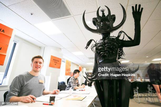 Tarikura Kapea, dressed in World of WearableArt garment 'Cambrian Regeneration' by Ran Xu of China, prepares to vote at Wellington City Library on...