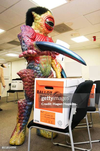 Dylan Nicholson, dressed in World of WearableArt garment 'Watcher in the Water' by Craig McMillan of New Zealand, votes at Wellington City Library on...