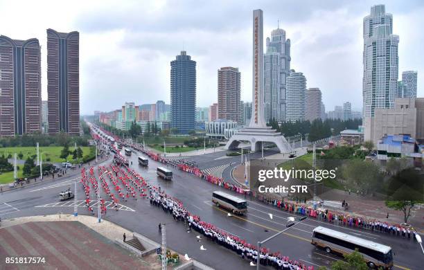 This September 6, 2017 picture released from North Korea's official Korean Central News Agency on September 7, 2017 shows Pyongyang residents...