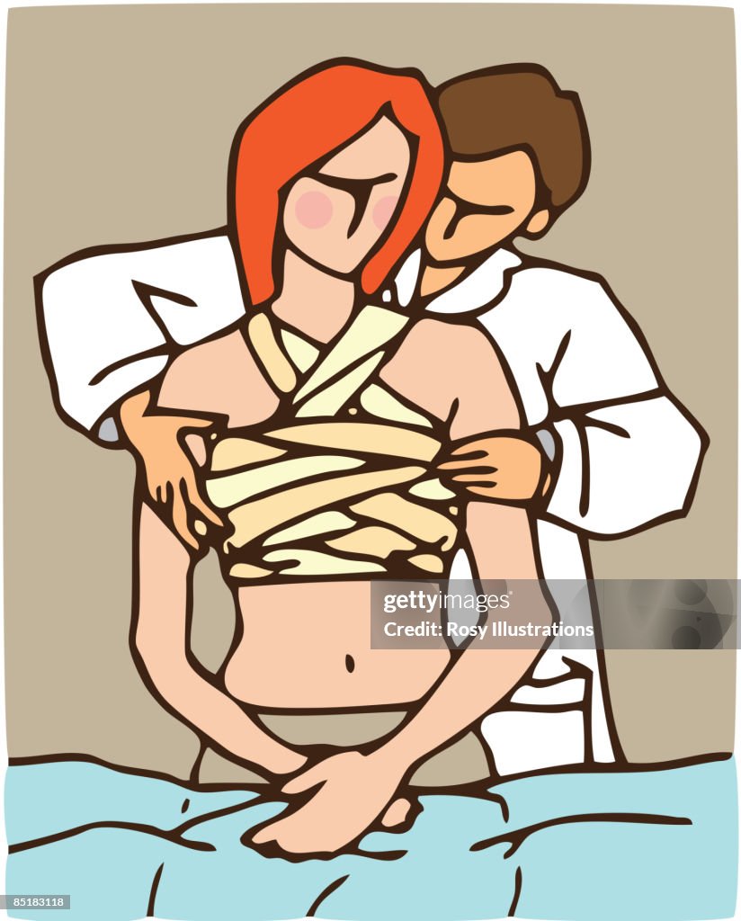 A doctor applying bandages to a female patients chest