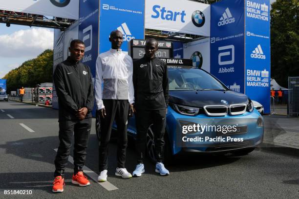 Kenenisa Bekele from Ethiopia, Eliud Kipchoge from Kenya and Wilson Kipsang from Kenya pose for the cameras at the starting line. The leading male...