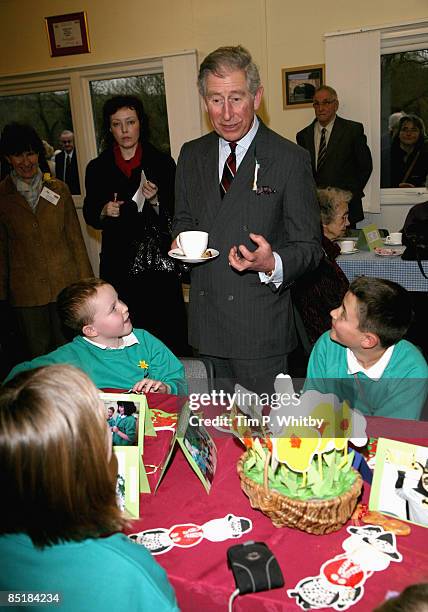 Prince Charles, Prince of Wales chats to local school children at the Froncysyllte Community Centre during his visit to Froncysyllte, winner of the...