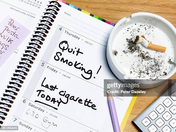 quit smoking deadline diary - quitting smoking stock pictures, royalty-free photos & images