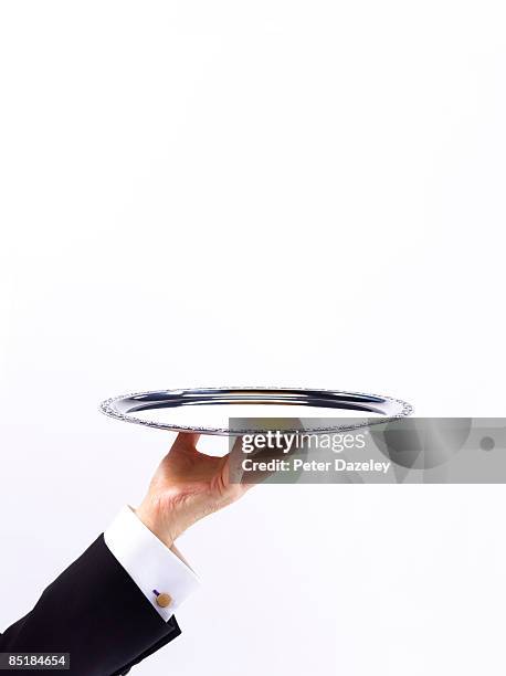 butler waiter with silver tray against white - silbertablett stock-fotos und bilder