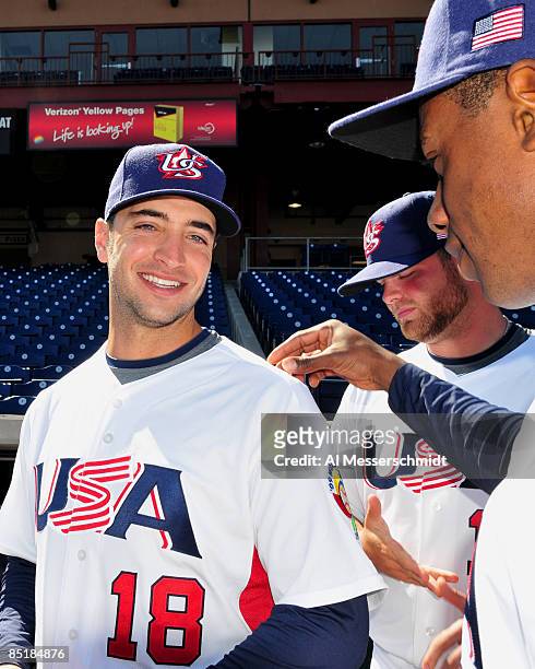 Outfielder Curtis Granderson of the USA World Baseball Classic team admires the new uniform of infielder Ryan Braun before a practice March 2, 2009...
