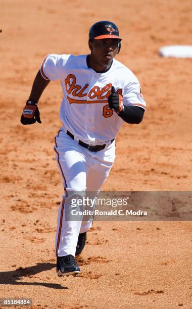 Melvin Mora of the Baltimore Orioles runs to third base during a spring training game against the Florida Marlins at Fort Lauderdale Stadium on...