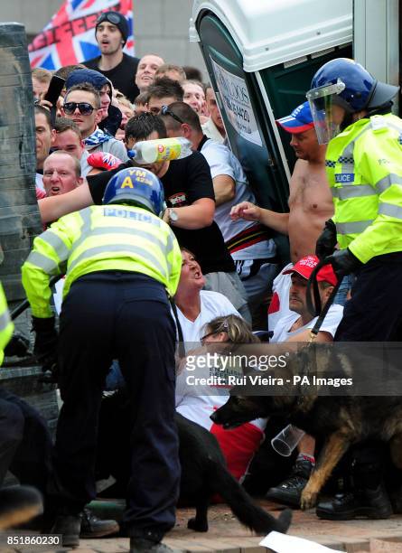 Membe vlash with the police during a EDL march at Centenary Square in Birmingham.
