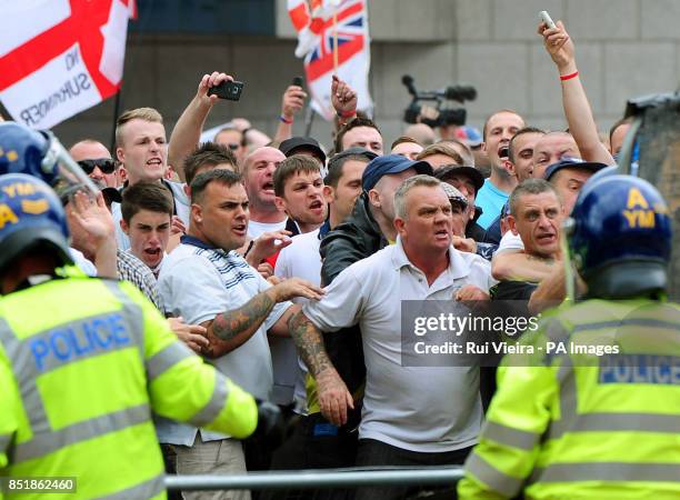 Members clash with the police during a EDL march at Centenary Square in Birmingham.