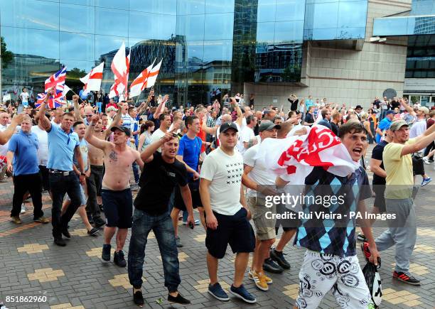 People participate in an EDL march at Centenary Square in Birmingham.