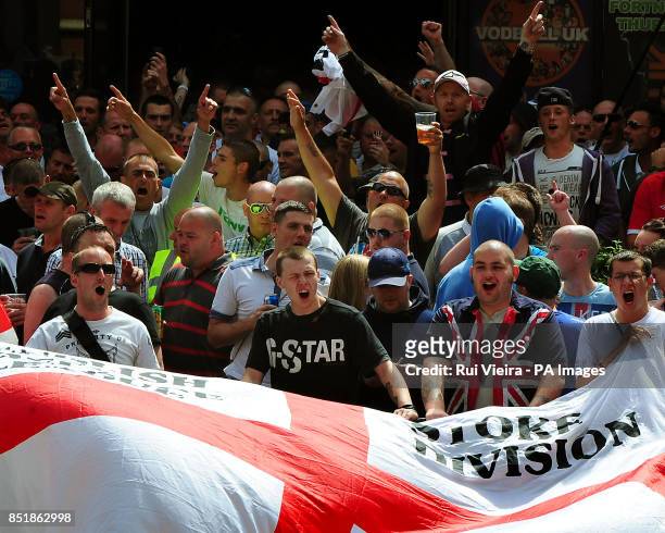 People participate in an EDL march at Centenary Square in Birmingham.