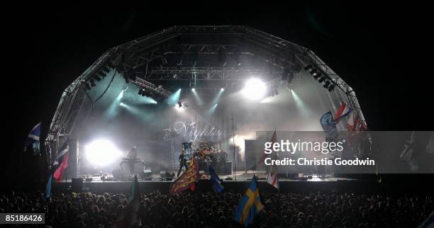 Photo of NIGHTWISH, Group performing on stage at night