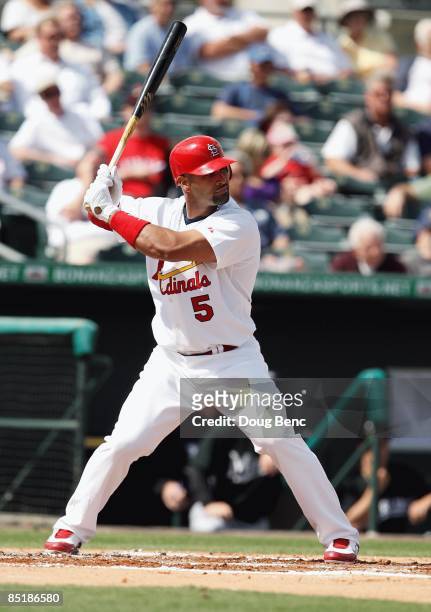 Albert Pujols of the St. Louis Cardinals bats against the Florida Marlins during a spring training game at Roger Dean Stadium on February 25, 2009 in...