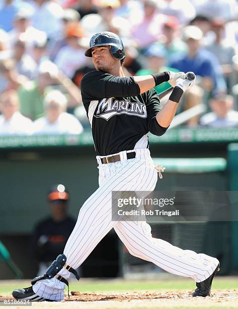 Jorge Cantu of the Florida Marlins bats against the Baltimore Orioles during a spring training game at Roger Dean Stadium on February 27, 2009 in...