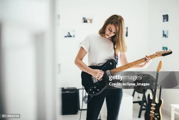 i am the woman in love... - woman playing guitar stock pictures, royalty-free photos & images