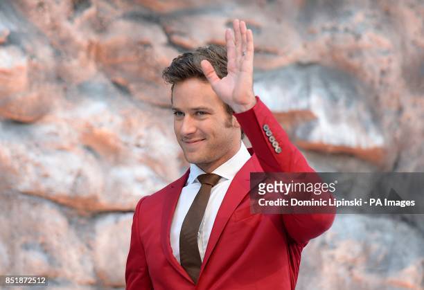 Armie Hammer waves whilst arriving at the UK Premiere of The Lone Ranger, at the Odeon West End cinema in London.