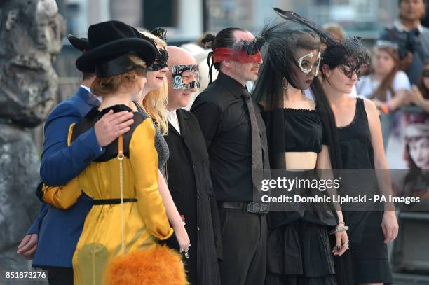 Guests in fancy dress arriving at the UK Premiere of The Lone Ranger, at the Odeon West End cinema in London.