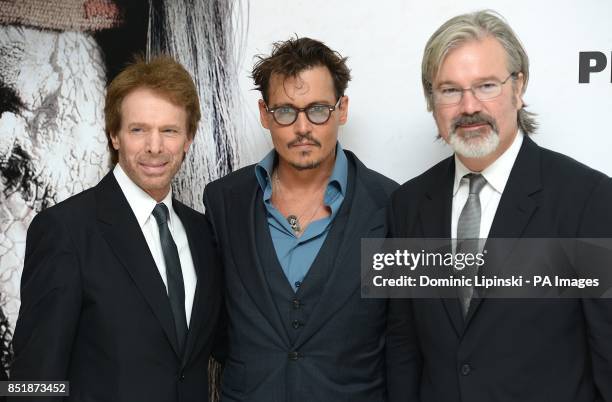 Jerry Bruckheimer, Johnny Depp and Gore Verbinski arriving at the UK Premiere of The Lone Ranger, at the Odeon West End cinema in London.