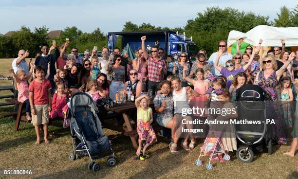 Local villagers gather in a field at the back of the Cottage Inn in Upper Bucklebury where they are having a party to celebrate the birth of the Duke...