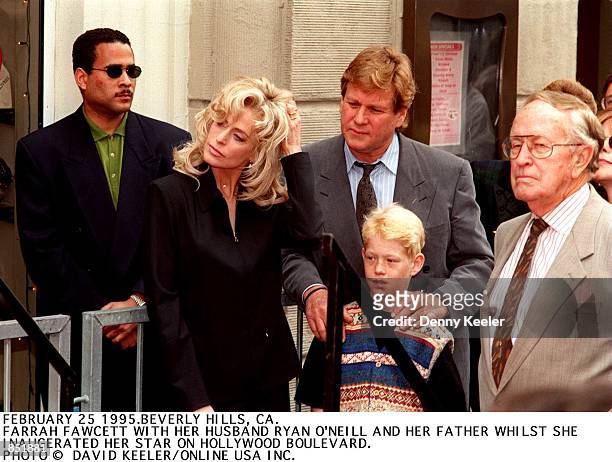 Beverly Hills, CA. Farrah Fawcett with Ryan O''Neal and their son, Redmond on Hollywood Boulevard where she received her star.
