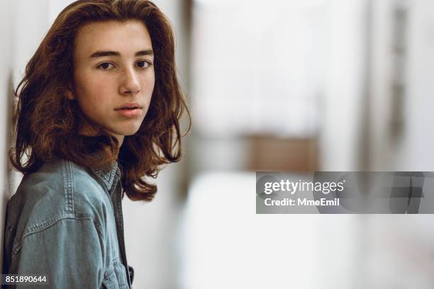 teenager portrait - boy with long hair stock pictures, royalty-free photos & images