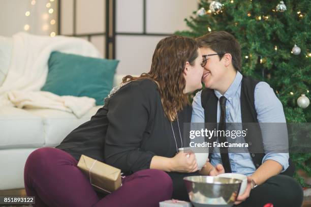 holiday kiss - gay santa claus stock pictures, royalty-free photos & images