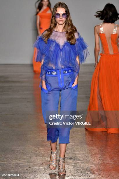 Model walks the runway at the Genny Ready to Wear Spring/Summer 2018 fashion show during Milan Fashion Week Spring/Summer 2018 on September 21, 2017...