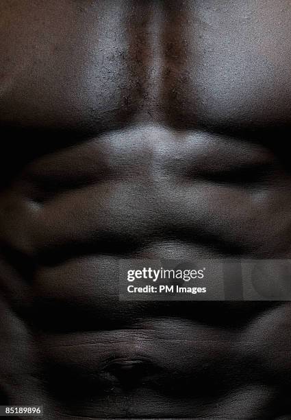 close-up of man's abdomen - ethnicity fotografías e imágenes de stock