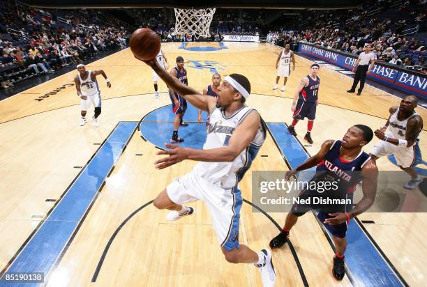 Dominic McGuire of the Washington Wizards shoots against Joe Johnson of the Atlanta Hawks at the Verizon Center on March 2, 2009 in Washington, DC....