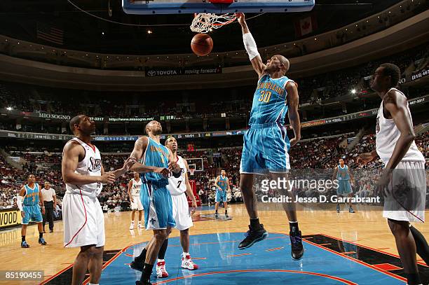 David West of the New Orleans Hornets dunks against the Philadelphia 76ers during the game on March 2, 2009 at the Wachovia Center in Philadelphia,...
