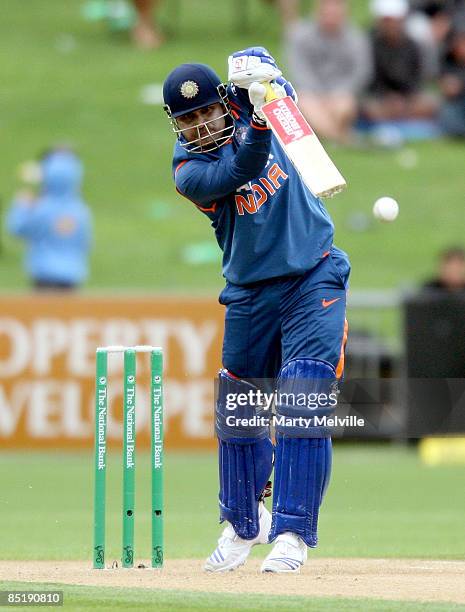 Virender Sehwag of India hits the ball during the first one day international match between the New Zealand Black Caps and India at McLean Park on...