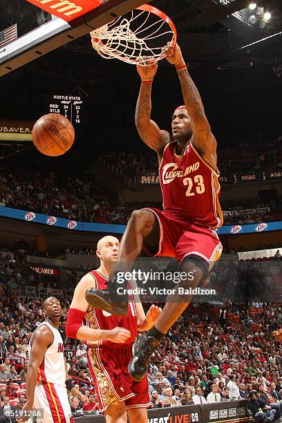 LeBron James of the Cleveland Cavaliers dunks against the Miami Heat on March 2, 2009 at the American Airlines Arena in Miami, Florida. NOTE TO USER:...