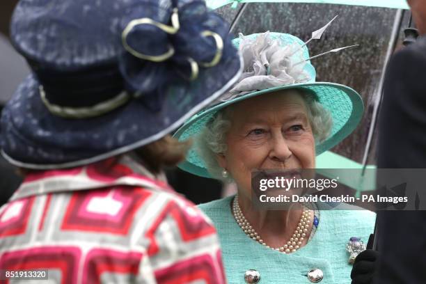 Queen Elizabeth II hosts a garden party at the Palace of Holyrood house in Edinburgh.