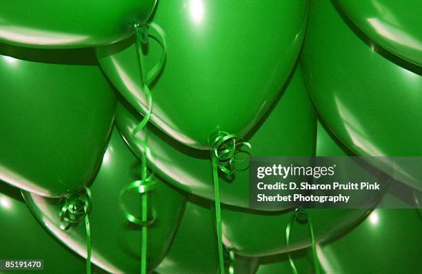 green birthday balloons - birthday balloons stock pictures, royalty-free photos & images