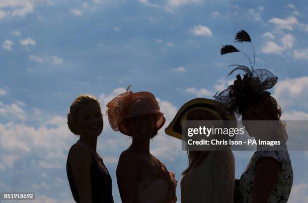 Ladies in hats on day three of Glorious Goodwood at Goodwood Racecourse, Chichester.