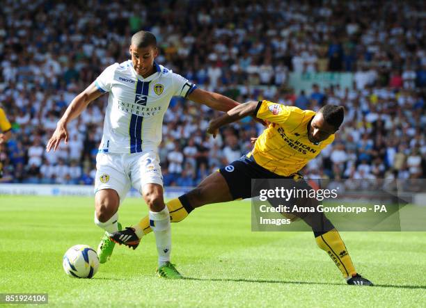 Leeds United's Lee Peltier and Brighton & Hove Albion's Kazenga Lualua in action during the Sky Bet Championship match at Elland Road, Leeds.