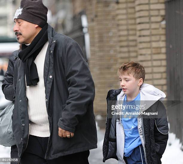 Madonna's son Rocco Ritchie enjoys the snow with his body guard in Central Park March 2, 2009 in New York City.