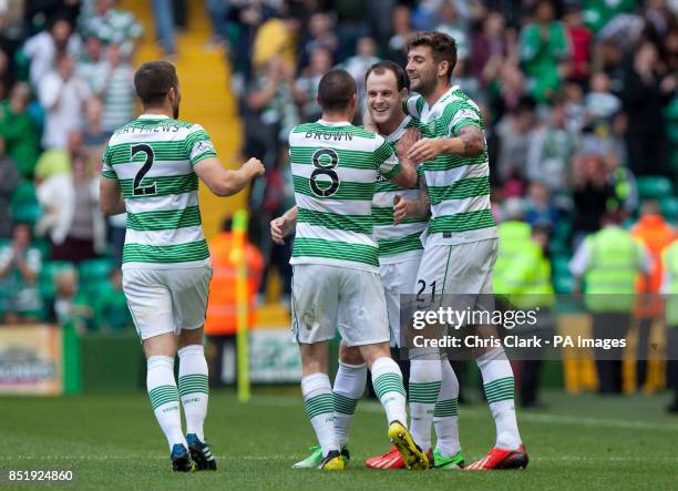 Celtic's Anthony Stokes celebrates with Adam Matthews, Scott Brown and Charlie Mulgrew after scoring the winning goal against Ross County during the...