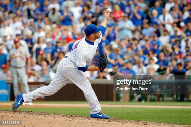 Brian Duensing of the Chicago Cubs pitches against the St. Louis Cardinals during the eighth inning at Wrigley Field on September 17, 2017 in...