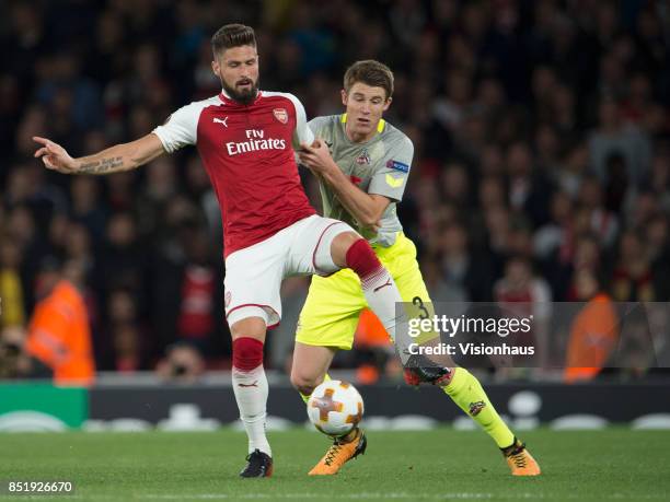 Olivier Giroud of Arsenal and Dominique Heintz of FC Cologne during the UEFA Europa League match between Arsenal FC and FC Cologne at Arsenal Stadium...