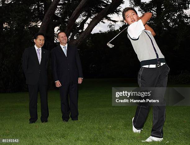 President of the Republic of Korea, Lee Myung-bak looks on with New Zealand Prime Minister John Key as Korean-born New Zealand golfer Danny Lee...