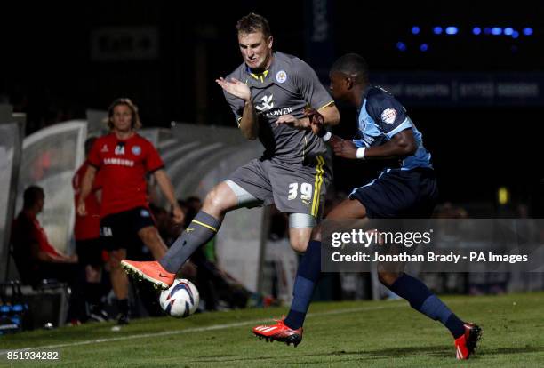 Leicester's Chris Wood braces himself in the air against the clearance from Wycombe's Kortney Hause during the Capital One Cup, First Round match at...