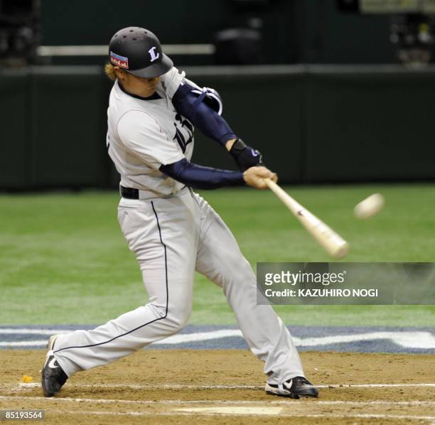 Japan's Saitama Seibu Lions outfielder Hisashi Takayama hits a two-run homer in the last inning against Taiwan at an exhibition game ahead of the...