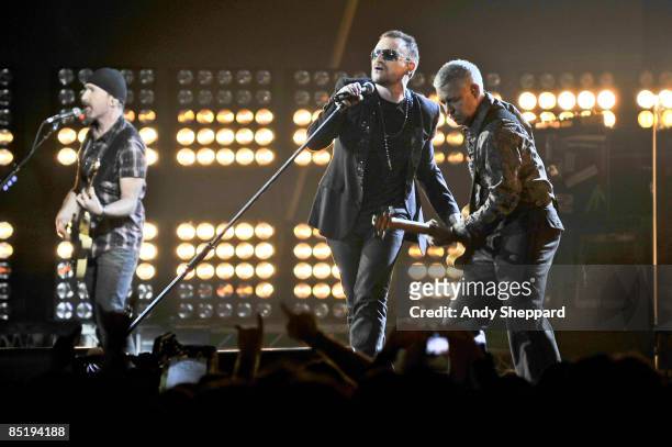 The Edge, Bono and Adam Clayton of U2 perform on stage at the 2009 Brit Awards held at Earls Court on February 18, 2009 in London.