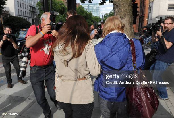 Domenico Rancadore's wife Anne Skinner and daughter Daniela leave Westminster Magistrates Court, after the fugitive Mafia boss was denied bail.