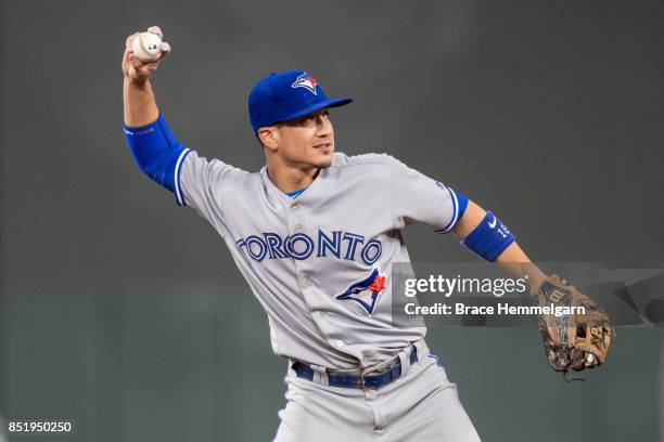 Darwin Barney of the Toronto Blue Jays throws against the Minnesota Twins on September 14, 2017 at Target Field in Minneapolis, Minnesota. The Twins...