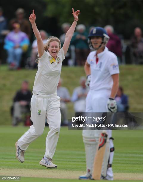Australia bowler Holly Ferling celebrates taking the wicket of England captain Charlotte Edwards during day two of the First Womens Ashes test match...