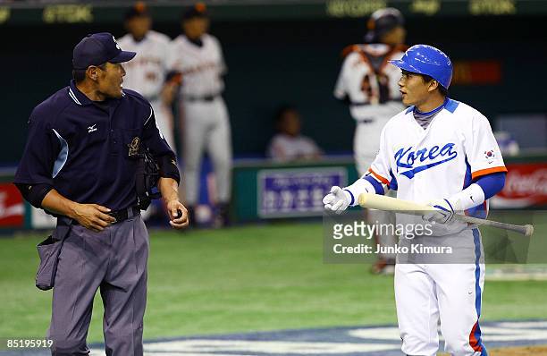 Outfielder Lee Jong Wook of South Korea appeals to an umpire during a friendly match between South Korea and Yomiuri Giants at Tokyo Dome on March 3,...