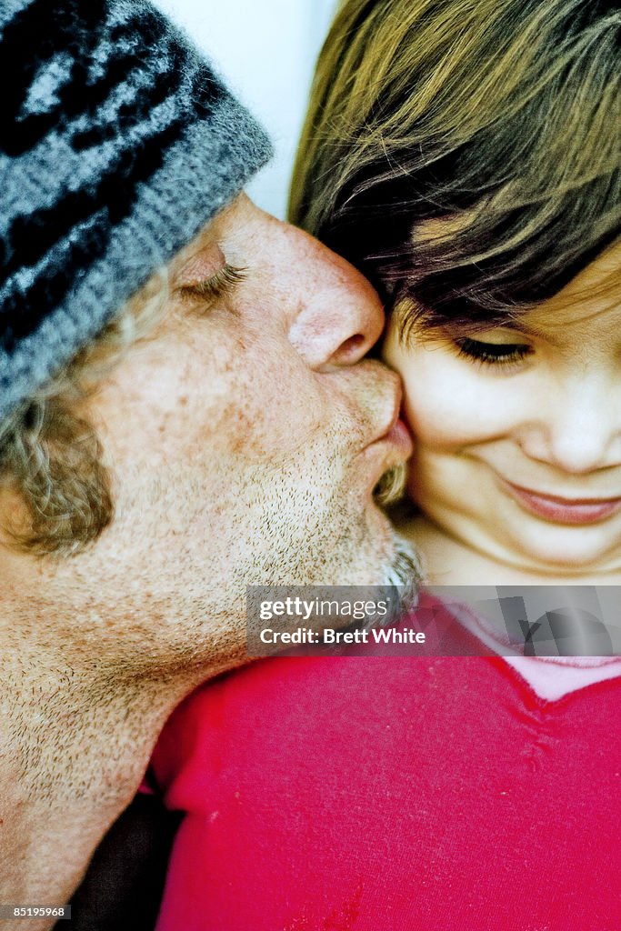 Father Kisses Daughter